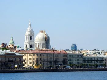 View of cathedral in city against clear sky