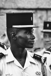 Soldier wearing uniform looking away in city