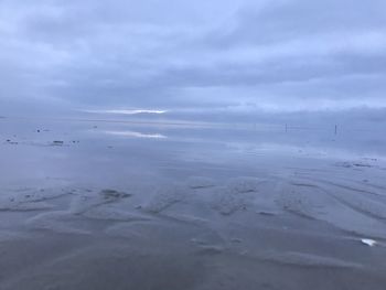 Scenic view of sea against sky during winter