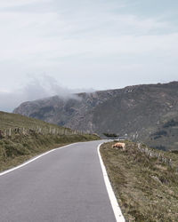 Road on mountain against sky