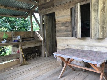 Empty chairs and table in building