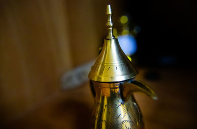 Close-up of glass bottle on table