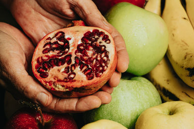 Midsection of person holding fruits