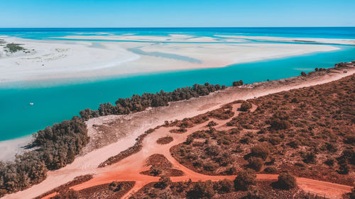 High angle view of beach against blue sky