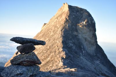 Rock formation on mountain against sky