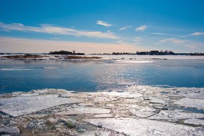 Scenic view of sea against blue sky