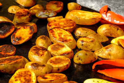 Close-up of potatoes cooking on electric stove