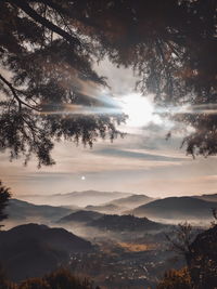 Scenic view of silhouette mountains against sky at sunset