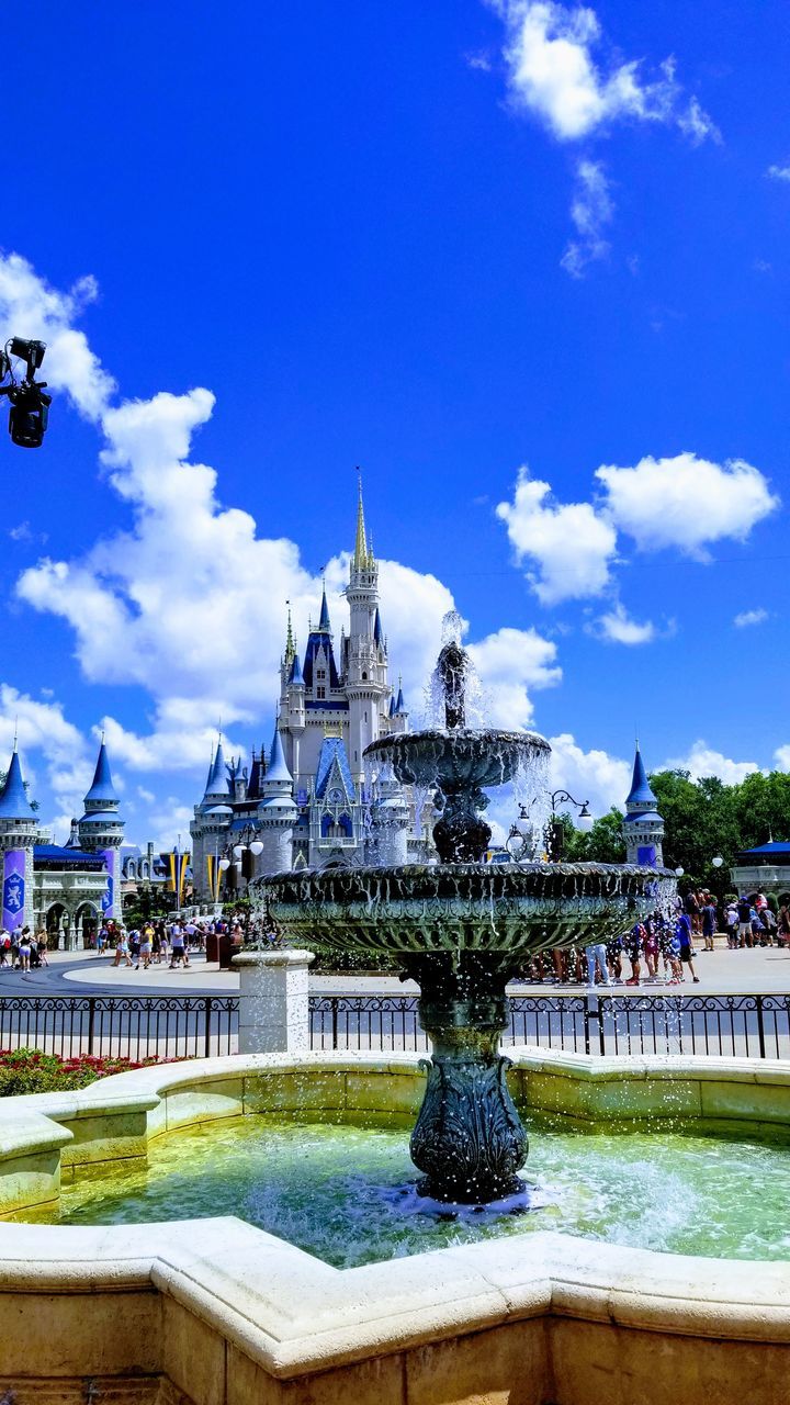 FOUNTAIN WITH BUILDING IN BACKGROUND