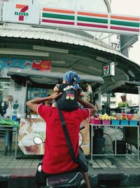 Rear view of man photographing