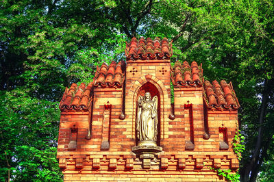 Low angle view of statue against building