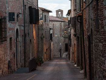 Narrow alley amidst buildings in city