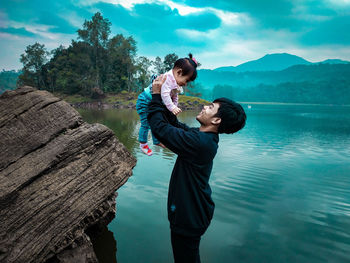 Young couple standing in water