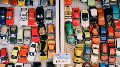 Full frame shot of colorful toy cars with label at store