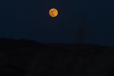 Scenic view of moon against sky at night