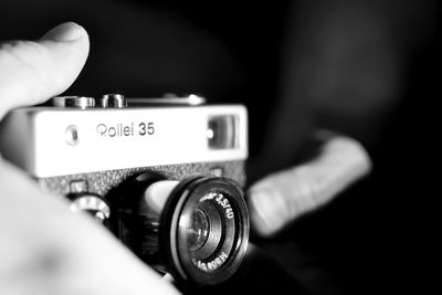 Close-up of hand holding camera