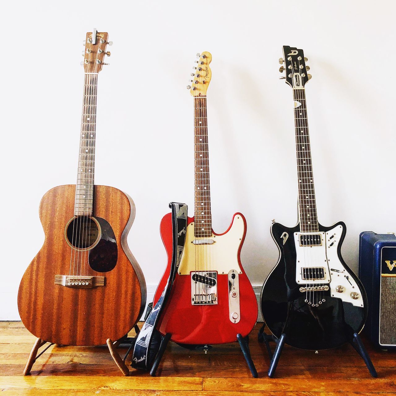 GUITAR AGAINST WALL