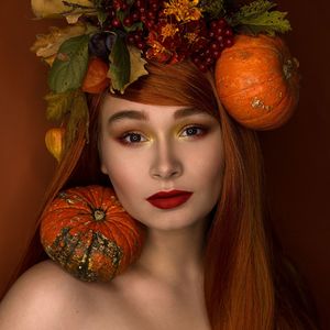 Portrait of young woman with decorative vegetables 