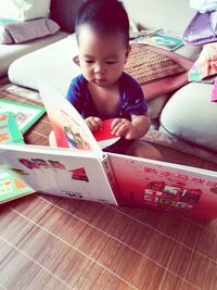 Boy playing with book