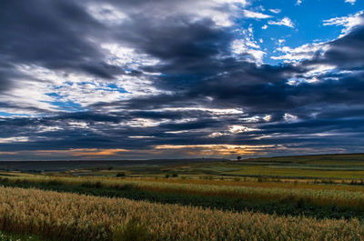 Scenic view of dramatic sky over landscape