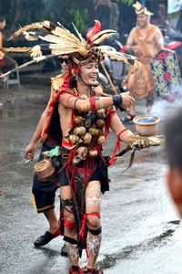 People dancing in traditional clothing during festival