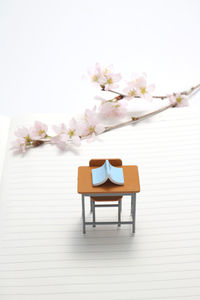 White flower vase on table