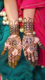 Close-up of woman with tattoo on hand