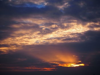 Low angle view of dramatic sky during sunset