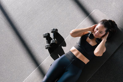 Young woman exercising on road