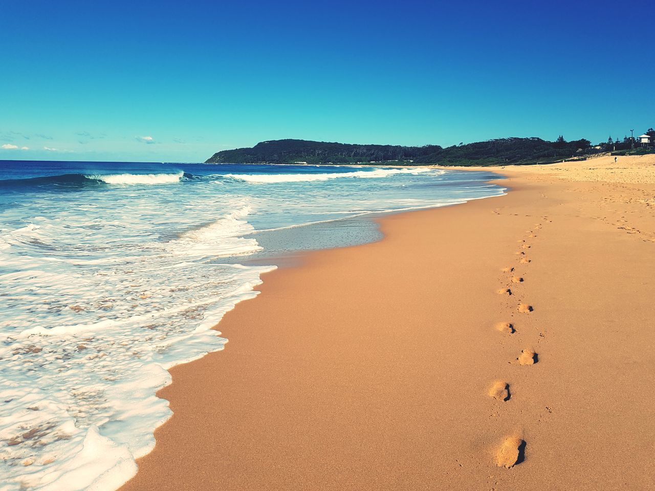 sand, beach, sea, nature, beauty in nature, water, shore, clear sky, scenics, wave, tranquil scene, outdoors, tranquility, day, horizon over water, sunlight, blue, no people, vacations, sky