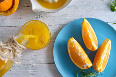 Summer still life with white wood background of orange juice where we