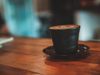 Close-up of coffee cup on table