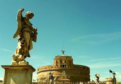 Low angle view of statue against sky