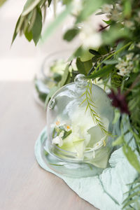 Close-up of flower in glass on table