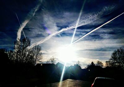 Scenic view of vapor trails in sky
