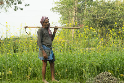 Full length of man standing on field