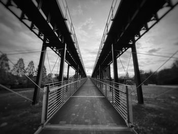 Bridge over road against sky
