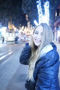 Portrait of smiling young woman in snow