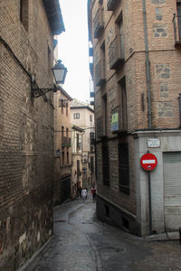 Road amidst buildings in city