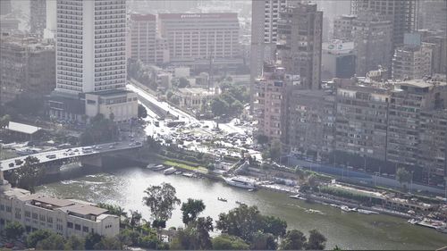 High angle view of river amidst buildings in city