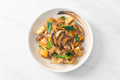 High angle view of food in bowl on white background