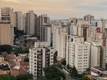 High angle view of buildings in city against sky