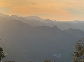 Scenic view of mountains against sky during sunset