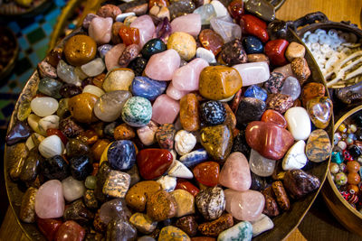 Close-up of colorful gemstones on tray