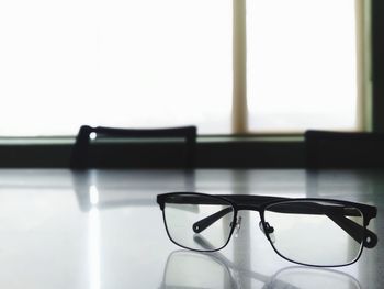 Close-up of eyeglasses on table