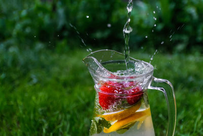 Close-up of water splashing in glass