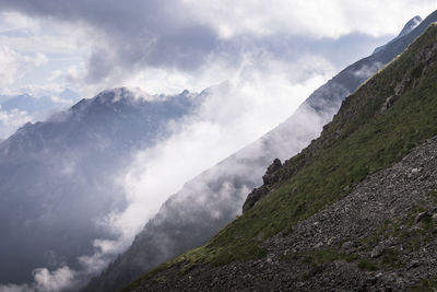 Low angle view of mountain range against sky