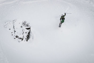 Man skiing on snowcapped mountain