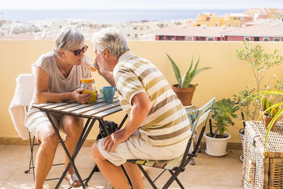 Senior couple enjoying wine at outdoors restaurant