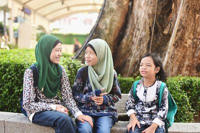 Women sitting in traditional clothing